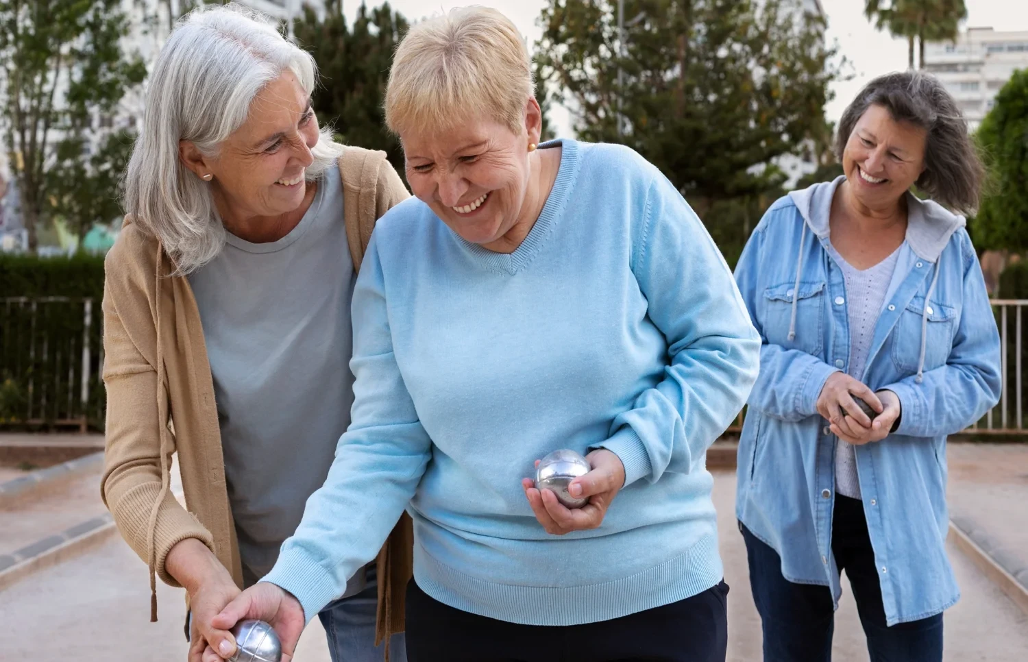 Elderly women enjoying an outdoor activity together, showcasing a safe and secure community atmosphere.