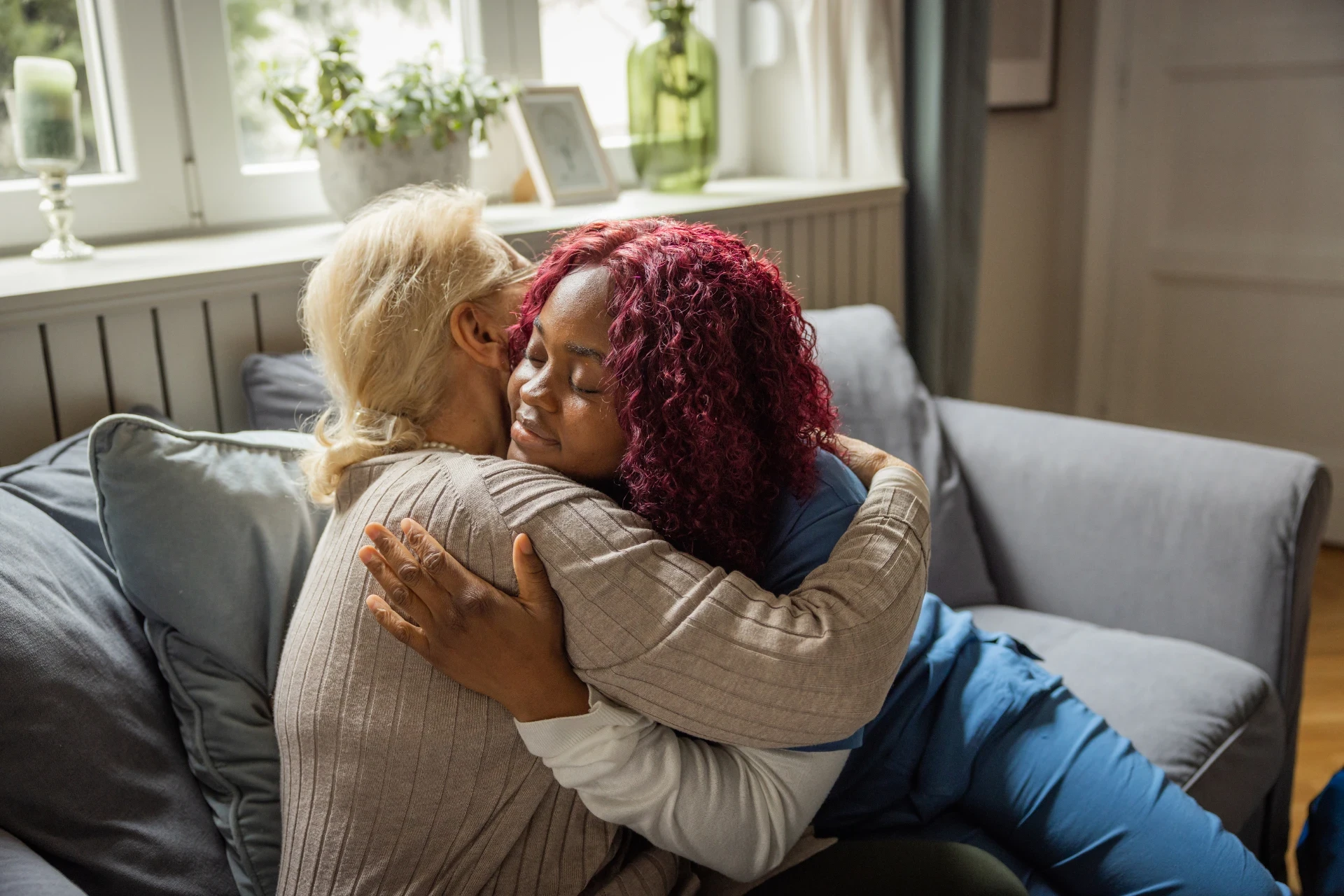 Caregiver offering compassionate emotional support to a senior at Elite Care Assisted Living in Lakeland, Florida.
